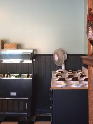 Dirty fan blowing over food. Oscillating fan blowing over uncovered cake and salad bar.