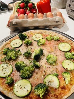 Farmer's market zucchini, pizza, radishes, eggs, broccoli