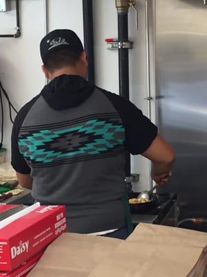 Guy making my Sierra breakfast burrito