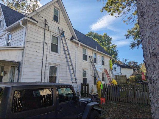 Cleaning siding with a soft wash and ceiling