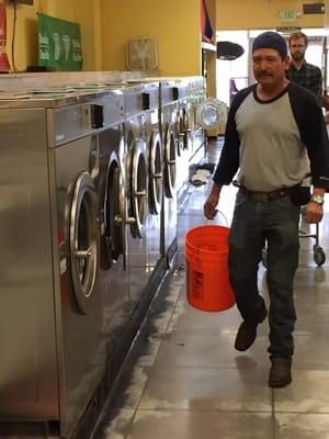 Employee pouring water into machines that don't work.