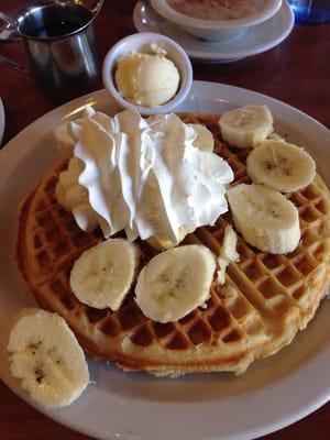 waffles with bananas and whipped cream.