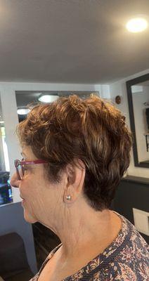 Root touch up on 70 % gray w/ golden highlights ,short layered cut with tapered neck sides .