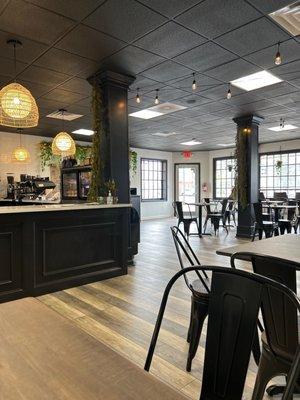 Open cafe with plenty of tables and polite staff.