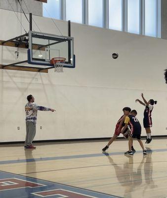 Basketball training at the gym.