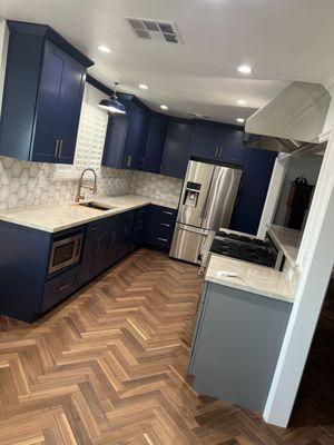 Our blue cabinets combined with our grey cabinets to add some contrast into the clients kitchen.