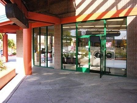 Clean and bright glass-walled laundry.