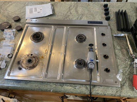 Viking Cooktop. This unit had issue with spark module. We had to cut old rings around burners in order to get under the cover! What a job!