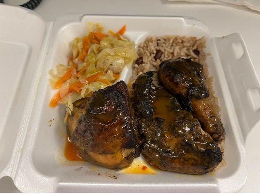 Jerk Shrimp with rice and peas and cabbage.