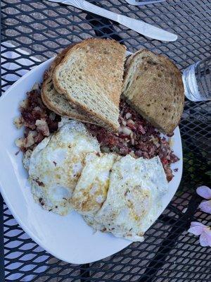 3-Eggs Any Style on Our Own Corned Beef Hash with rye toast