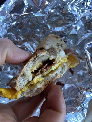 Bacon egg and cheese on spinach bagel