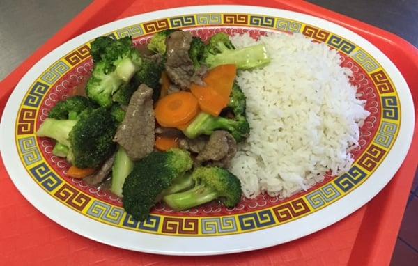 Beef Broccoli- Lightly marinated sliced beef. Wok cooked with broccoli and carrots in our delicious light ginger onion brown sauce.