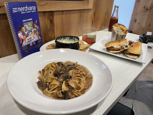 Beef stroganoff, spinach and artichoke dip, a chicken sandwich w fries and the marquee (whiskey, basil, vodka and something else)