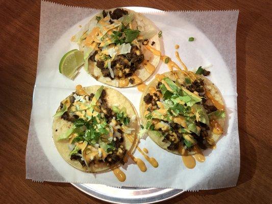 Korean Taco( Onion, Bulgogi Beef, Cheese, lettuce, cilantro, scallion with spicy  house sauce)