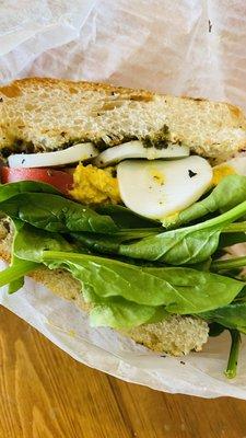 Nana Love Sandwich on focaccia - egg, humus, pesto, spinach, tomato