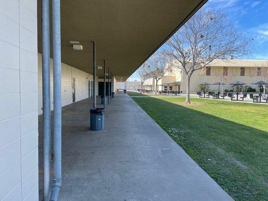 Hallway leading to classes and electric lunch tables.