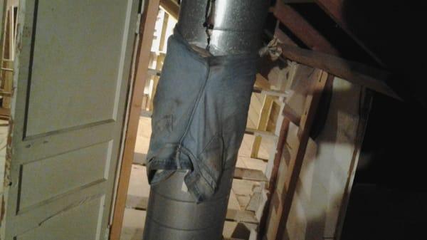 Leak around a fireplace flue was repaired by tying blue jeans around the flue