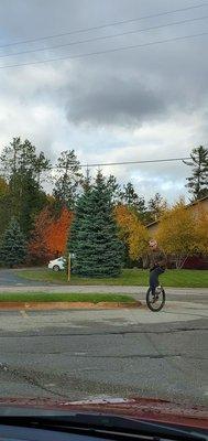 Saw this guy on a unicycle on his way into the parking lot to shop?? Hope it's less than 3 items