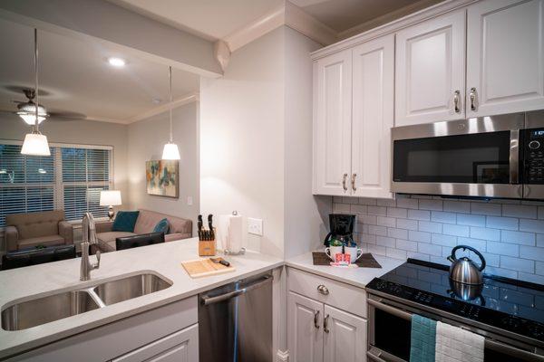 Custom White Cabinetry with Brushed Nickel Finishes