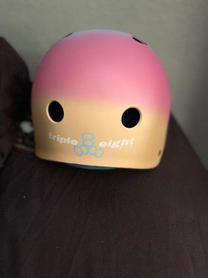 The back of my triple 8 helmet . Color: sunset