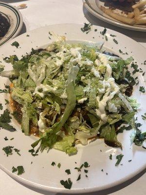 Underneath the greens is amazing Enchiladas with Mole Poblano.  Get this.  The mole is amazing