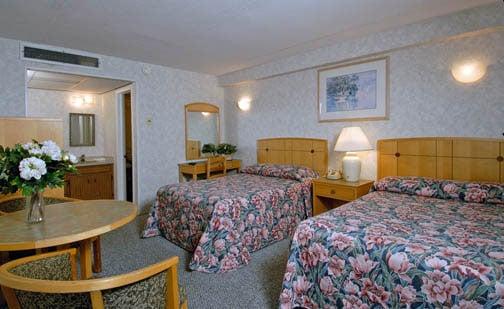 Type A room. Includes two full size beds, bathroom, microwave, minfridge, coffeemaker, and tv.