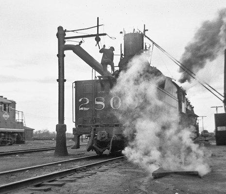 Illinois Central #2809 taking water and coal at Kankakee, Illinois  (1957)