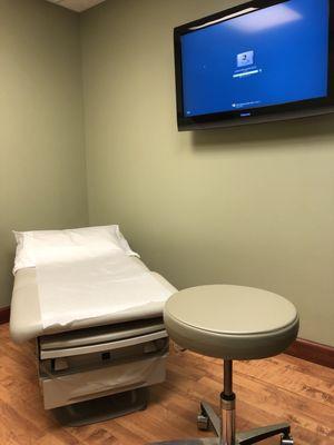 Patient rooms are clean/simple and they have TVs! - great for looking at X-rays with the doctor