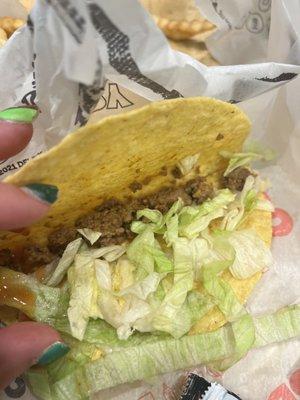 Taco with hardly any meat cold fries