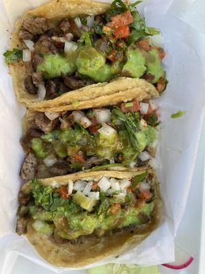 Steak tacos with Pico de Gallo and salsa verde.