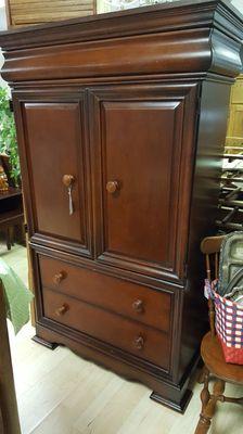 Entertainment center with hidden drawer