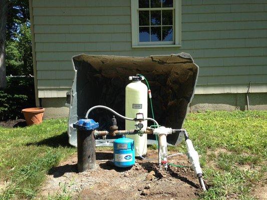 Well and Pump Systems fit underneath an artificial rock