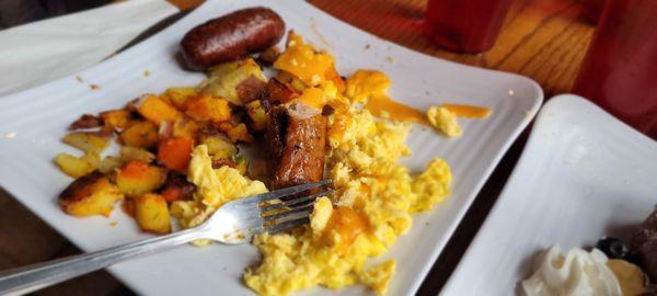 Scrambled eggs with cheese homefries and sausage