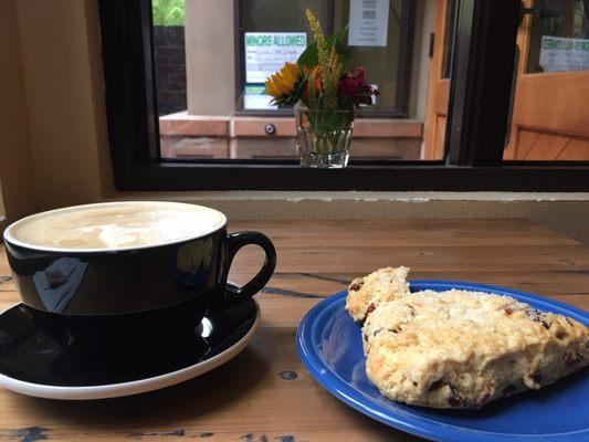 Latte and a cranberry scone.