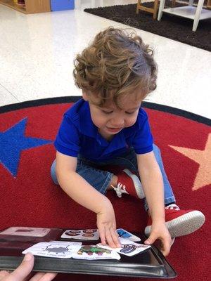 my son checking the schedule in the Pre-k 2 class