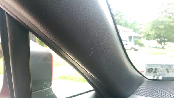 Tiny scratch on A pillar of "new" car.  Lesson here is to your inspect new vehicle carefully.