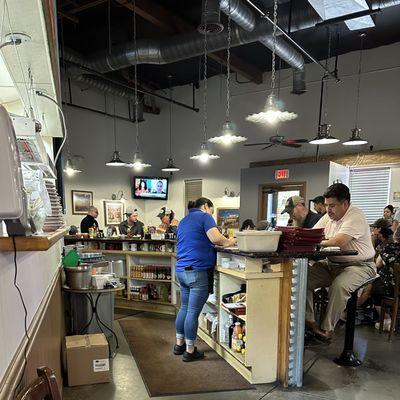 You can eat at the counter (tables or booths), and there are T.V.s visible from all.