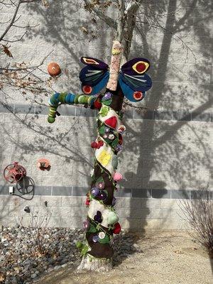 Yarn-bombed tree outside..