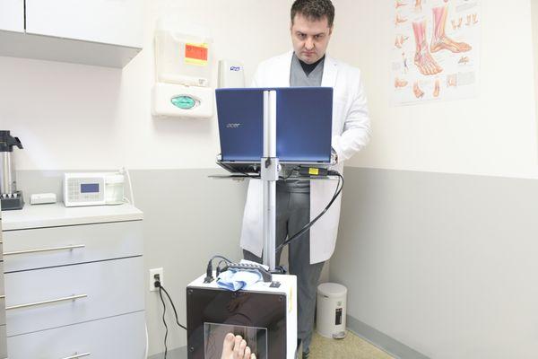 Clifton, NJ podiatrist Dr. Velimir Petkov creating 3D custom orthotics for a patient.