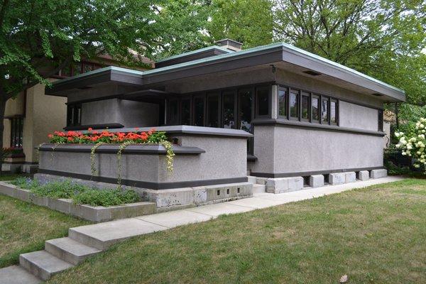 The Model B1 Bungalow at the corner of S 27th St and Burnham St, adjacent to the four Model 7a (Model C or Model F) duplexes.