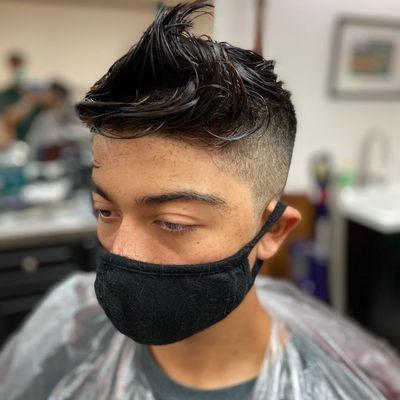 Zero fade into a full, scissor cut top.