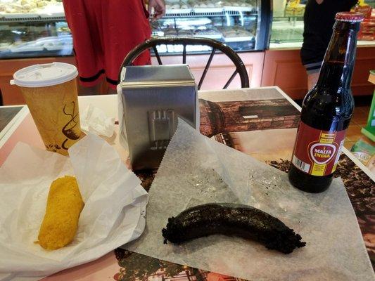 Morcilla ( blood susage ) and a sorullo for breakfast with a Malta India