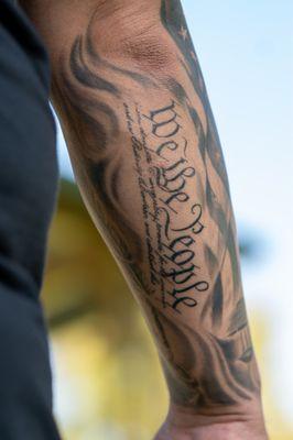 "We The People" on forearm