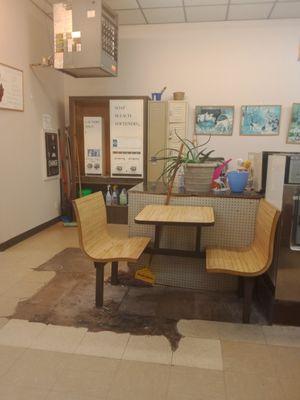 Vending soap machine,bags and a little booth to sit while waiting on laundry