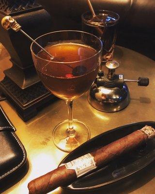 Manhattan and a fine cigar watching the game