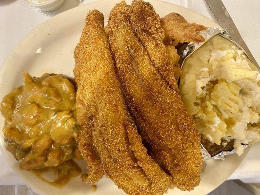 Crab with crawfish étouffée, catfish, baked potato.  It was a seafood platter