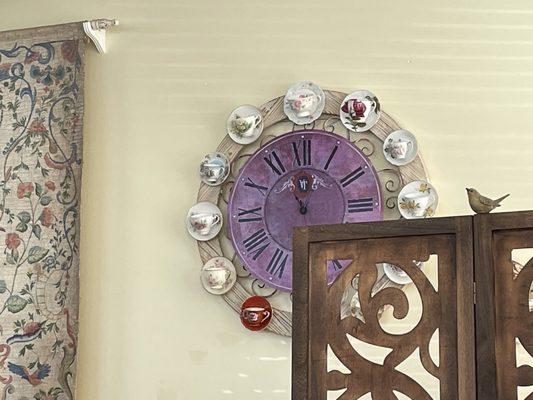 Many pretty pictures and flowery themed art on the walls, this clock made from 12 tea cups and saucers caught my eye!