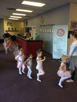 Practicing high legs on the way to the water fountain.