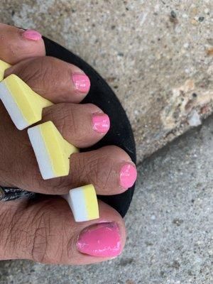 Picture taken outside the salon right after the pedicure. Uneven nail and part of the nail missing nailpaint