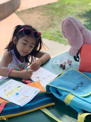 Doing her Kumon at the Park